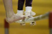 22 April 2006; A general view of a gymnasts hands and feet on the A-symmetrical bars. National Gymnastics Championships, National Basketball Arena, Tallght, Dublin. Picture credit: Brendan Moran / SPORTSFILE