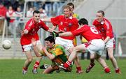 23 April 2006; Michael Hegarty, Donegal, is surrounded by Louth's Mark Breenan, Christy Grimes and Peter McGinnity, Louth. Allianz National Football League, Division 2 Final, Donegal v Louth, Kingspan Breffni Park, Cavan. Picture credit: Oliver McVeigh / SPORTSFILE