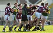 23 April 2006; Kerry and Galway players clash as referee Eugene Murtagh tries to separate the players. Allianz National Football League, Division 1 Final, Kerry v Galway, Gaelic Grounds, Limerick. Picture credit: Damien Eagers / SPORTSFILE