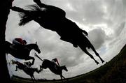 25 April 2006; The runners and riders clear the 'Bluesquare Wall' during the DNG Nationwide Steeplechase. Punchestown Racecourse, Co. Kildare. Picture credit: Pat Murphy / SPORTSFILE