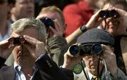 25 April 2006; Racegoers keep a close eye on the action during the Kerrygold Champion Steeplechase. Punchestown Racecourse, Co. Kildare. Picture credit: Pat Murphy / SPORTSFILE