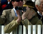 25 April 2006; A race fan keeps a close eye on the action during the Evening Herald Handicap Hurdle. Punchestown Racecourse, Co. Kildare. Picture credit: Pat Murphy / SPORTSFILE