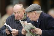 26 April 2006; Racefans check the form before the Stallion Farms EBF Mares Hurdle. Punchestown Racecourse, Co. Kildare. Picture credit: Pat Murphy / SPORTSFILE