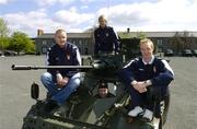 26 April 2006; St Patrick's Athletic players Barry Ryan, left, Glen Larsen, centre, and Paul Keegan sit on a AML 20 with Trooper Derek Moore at a photocall ahead of St Patrick's Athletic's eircom Premier Division game against Cork City this weekend. Cathal Brugha Army Barracks, Rathmines, Dublin. Picture credit: Damien Eagers / SPORTSFILE