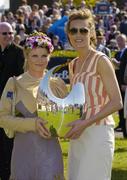 28 April 2006; Niamh McCoy, from Naas, Co Kildare, who won the Newbridge Silverware ladies day best dressed competition is presented with the trophy by model Yasmin Le Bon, right. Punchestown Racecourse, Co. Kildare. Picture credit: Matt Browne / SPORTSFILE