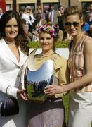 28 April 2006; Niamh McCoy, from Naas, Co Kildare, who won the Newbridge Silverware ladies day best dressed competition is presented with the trophy by models Andrea Roche, left, and Yasmin Le Bon, right. Punchestown Racecourse, Co. Kildare. Picture credit: Matt Browne / SPORTSFILE
