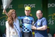 21 May 2014; Eoin McCarthy, on the podium after Stage 4 of the 2014 An Post Rás with Miss An Post Rás, Lauren O'Sullivan and Tony Campbell. Charleville - Cahirciveen. Picture credit: Ramsey Cardy / SPORTSFILE