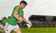 18 May 2014; Leitrim captain Emlyn Mulligan breaks away from the pre-match team photograph before the game. Connacht GAA Football Senior Championship Quarter-Final, Roscommon v Leitrim, Dr. Hyde Park, Roscommon. Picture credit: Piaras Ó Mídheach / SPORTSFILE