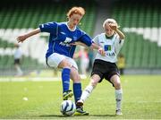 28 May 2014; Aoife Kenny, Scoil Phadraig, Milltown, Westmeath, in action against Clare Brown, Scoil Cholmcille, Greencastle, Inishowen, Donegal. Aviva Health FAI Primary School 5’s National Finals, Scoil Phadraig, Milltown, Westmeat  v Scoil Cholmcille, Greencastle, Inishowen, Donegal, Aviva Stadium, Lansdowne Road, Dublin. Picture credit: Pat Murphy / SPORTSFILE