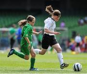 28 May 2014; Kate McClenaghan, Scoil Cholmcille, Greencastle, Inishowen, Co. Donegal, in action against Louise Sheridan, Holy Family NS, Newport, Mayo. Aviva Health FAI Primary School 5’s National Finals, Scoil Cholmcille, Greencastle, Inishowen, Co. Donegal v Holy Family NS, Newport, Mayo, Aviva Stadium, Lansdowne Road, Dublin. Picture credit: Ashleigh Fox / SPORTSFILE