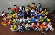 25 April 2006; At the announcment by Kellogg's of a joint initiative with the Gaelic Athletic Association to offer an exclusive range of specially commissioned breakfast bowls designed in the 32 county colours are, GAA President Nickey Brennan with young GAA players representing the 32 counties, Patrick Cullen, Antrim, Ashley Taaffe, Armagh, Laura Heffernan, Carlow, Laura Fitzpatrick, Cavan, Louise O'Meara, Clare, Dean Fitzpatrick, Cork, Conor Gibney, Derry, Levi McKinney, Donegal, Nicole Boadman, Down, Cian Lenihan, Dublin, Gabhan O Meachair, Fermanagh, Roisin Foley, Galway, Natalia Harrison, Kerry, Sam Verdon, Kildare, Daire Kinsella, Kilkenny, Kevwe Marks, Laois, Emma Fenton, Leitrim, Micheal O Caoimh, Limerick, Cian Malone, Longford, Erin O'Reilly, Louth, Sabrina McCormack, Mayo, Noelle O'Donnell, Meath, Cian O'Carroll, Monaghan, Catriona Kenny, Offaly, Sarah Barrett, Roscommon, Ronan McDyer, Sligo, Stiofan MacAntsaoair, Tipperary, Rebecca Kinsella, Tyrone, Shauna James, Waterford, Joseph Ryan, Westmeath, Gary Foley, Wexford, Joseph Beauchamp, Wicklow. Croke Park, Dublin. Picture credit: David Maher / SPORTSFILE