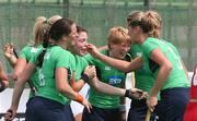 25 April 2006; The Irish Women's Hockey team congratulate Cathy McKeen after she had scored Ireland's goal against the USA in Rome. The USA scored to equalise with 40 seconds remaining on the clock and the game finished a draw. Ireland v USA, Samsung Women's Hockey World Cup Qualifier, Rome, Italy. Picture credit: SPORTSFILE