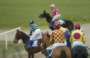 26 April 2006; The runners and riders make their way out for the start of the Blue Square Handicap Hurdle. Punchestown Racecourse, Co. Kildare. Picture credit: Brian Lawless / SPORTSFILE
