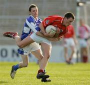 29 April 2006; Patrick Kelly, Cork, in action against Craig Rogers, Laois. Cadbury's U21 Football Semi-final Replay. Laois v Cork, Gaelic Grounds, Limerick. Picture credit: Kieran Clancy / SPORTSFILE