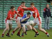 29 April 2006; Colm Kelly, Laois, in action against Ray Carey, Chris Murphy and Fintan Gould, Cork. Cadbury's U21 Football Semi-final Replay. Laois v Cork, Gaelic Grounds, Limerick. Picture credit: Kieran Clancy / SPORTSFILE