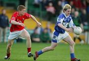29 April 2006; Michael Tierney, Laois, in action against Stephen O'Donoghue, Cork. Cadbury's U21 Football Semi-final Replay. Laois v Cork, Gaelic Grounds, Limerick. Picture credit: Kieran Clancy / SPORTSFILE