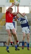 29 April 2006; Fintan Gould, Cork, in action against Brendan Quigley and Peter O'Leary, Laois. Cadbury's U21 Football Semi-final Replay. Laois v Cork, Gaelic Grounds, Limerick. Picture credit: Kieran Clancy / SPORTSFILE