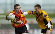 1 May 2006; Niall Devlin, Abbey CBS, is tackled by Kieran Lynch, St. Patricks. Hogan Cup Senior A Football Final, Abbey CBS v St. Patricks, Dr. Cullen Park, Carlow. Picture credit: Pat Murphy / SPORTSFILE