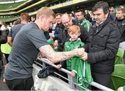 29 May 2014; Republic of Ireland's James McClean signs a shirt for a fan after squad training ahead of their international friendly against Italy on Saturday. Republic of Ireland Squad Training, Aviva Stadium, Lansdowne Road, Dublin. Picture credit: Ramsey Cardy / SPORTSFILE