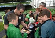 29 May 2014; Republic of Ireland's John O'Shea signs an autograph for a fan after squad training ahead of their international friendly against Italy on Saturday. Republic of Ireland Squad Training, Aviva Stadium, Lansdowne Road, Dublin. Picture credit: Ramsey Cardy / SPORTSFILE