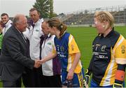 3 May 2014; Pat Quill, President of the Ladies Gaelic Football Association, is greeted by Roscommon captain Feena Beirne before the game. TESCO Ladies National Football League Division 4 Final, Antrim v Roscommon, O'Connor Park, Tullamore, Co. Offaly. Picture credit: Ray McManus / SPORTSFILE