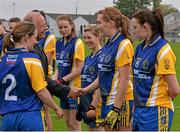 3 May 2014; Pat Quill, President of the Ladies Gaelic Football Association, shakes hands with Martina Freyne as greets the Roscommon team before the game. TESCO Ladies National Football League Division 4 Final, Antrim v Roscommon, O'Connor Park, Tullamore, Co. Offaly. Picture credit: Ray McManus / SPORTSFILE