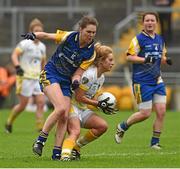 3 May 2014; Máiríosa McGourty, Antrim, in action against Emer Callaghan, Roscommon. TESCO Ladies National Football League Division 4 Final, Antrim v Roscommon, O'Connor Park, Tullamore, Co. Offaly. Picture credit: Ray McManus / SPORTSFILE