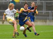 3 May 2014; Máiríosa McGourty, Antrim, in action against Ruth Finlass, Roscommon. TESCO Ladies National Football League Division 4 Final, Antrim v Roscommon, O'Connor Park, Tullamore, Co. Offaly. Picture credit: Ray McManus / SPORTSFILE