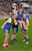 3 May 2014; Roscommon captain Feena Beirne, centre, is held aloft by her team-mates, from left, Niamh Ward, Carol Manning and Siobháin Tully, as they celebrate with the cup after the game. TESCO Ladies National Football League Division 4 Final, Antrim v Roscommon, O'Connor Park, Tullamore, Co. Offaly. Picture credit: Ray McManus / SPORTSFILE
