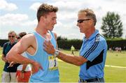 31 May 2014; Harry Purcell, Castleknock College, Dublin, is congratulated by his coach Senator Eamonn Coghlan after winning the Senior Boys 800m event, where he set a new record of 1:49.42. The Aviva All-Ireland Schools Track and Field Championships. Tullamore Harriers, Tullamore, Co. Offaly. Picture credit: Tomás Greally / SPORTSFILE