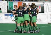 1 May 2006; Irish players Jill Orbinson, left, Ciara O'Brien, Linda Caulfield and Bridget McKeever congratulate Catriona Carey, 8, on scoring their side's winning goal. Samsung Women's Hockey World Cup Qualifier, Ireland v Italy, Rome, Italy. Picture credit: SPORTSFILE