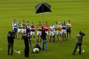 3 May 2006; ‘Immortality Beckons’ for the winner of the Liam MacCarthy Cup. Pictured officially launching the 2006 Guinness All-Ireland Senior Hurling Championship surrounded by the media, are captains, from left, Paul Flynn, Waterford, TJ Ryan, Limerick, Keith Rossiter, Wexford, Philip Brennan, Dublin, Liam Donoghue, Galway, Jackie Tyrrell, Kilkenny, Pat Mulcahy, Cork, Patrick Mullaney, Laois, Brendan Murphy, Offaly, Karl McKeegan, Antrim, Ger O'Grady, Tipperary and Sean McMahon, Clare. This year’s Guinness advertising campaign for the Hurling Championship focuses on how winning the Liam MacCarthy Cup will immortalise the team in Irish sporting history, alongside all the previous winners. Picture credit: Brendan Moran / SPORTSFILE