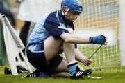 30 April 2006; Kevin Flynn, Dublin, ties up his boots during the game. National Hurling League, Division 2 Final. Dublin v Kerry, Semple Stadium, Thurlus, Co. Tipperary. Picture credit: David Maher / SPORTSFILE