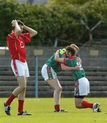 7 May 2006; Cork's Eoin Cadogan, left, shows his dissapointment as Mayo players Aidan Kilcoyne, right, and Tom Cunniffe celebrate victory. Cadbury's All-Ireland U21 Football Final, Cork v Mayo, Cusack Park, Ennis, Co. Clare. Picture credit; Ciara Lyster / SPORTSFILE
