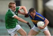 31 May 2014; Peter Acheson, Tipperary, in action against Sean O'Dea, Limerick. Munster GAA Football Senior Championship, Quarter-Final, Limerick v Tipperary, Gaelic Grounds, Limerick. Picture credit: Diarmuid Greene / SPORTSFILE