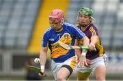 1 June 2014; Chris O'Connell, Antrim, in action against Conor McDonald, Wexford. Leinster GAA Hurling Senior Championship, Quarter-Final, Wexford v Antrim, O'Moore Park, Portlaoise, Co. Laois. Picture credit: Matt Browne / SPORTSFILE