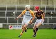 1 June 2014; Neil McManus, Antrim, in action against Diarmuid O'Keeffe, Wexford. Leinster GAA Hurling Senior Championship, Quarter-Final, Wexford v Antrim, O'Moore Park, Portlaoise, Co. Laois. Picture credit: Tomás Greally / SPORTSFILE