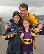 1 June 2014; Ciaran McClean from Wexford town, with his daughters Aisling, left, aged nine, and Niamh, aged seven, before the start of the game. Leinster GAA Hurling Senior Championship, Quarter-Final, Wexford v Antrim, O'Moore Park, Portlaoise, Co. Laois. Picture credit: Tomás Greally / SPORTSFILE