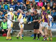1 June 2014; Eoghan Campbell, Antrim, is sent off by referee Alan Kelly. Leinster GAA Hurling Senior Championship, Quarter-Final, Wexford v Antrim, O'Moore Park, Portlaoise, Co. Laois. Picture credit: Matt Browne / SPORTSFILE