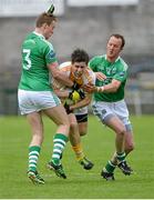 1 June 2014; Kevin O'Boyle, Antrim, in action against Che Cullen, left, and Paul Ward, Fermanagh. Ulster GAA Football Senior Championship, Quarter-Final, Fermanagh v Antrim, Brewster Park, Enniskillen, Co. Fermanagh. Picture credit: Oliver McVeigh / SPORTSFILE