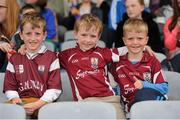 1 June 2014; Galway supporters, from left, Lorcan Cunningham, aged 9, with his brothers, Eamon, aged 7, and Eoin, aged 5, from Tynagh, Co. Galway, before the start of the game. Leinster GAA Hurling Senior Championship, Quarter-Final, Galway v Laois, O'Moore Park, Portlaoise, Co. Laois. Picture Credit: Tomás Greally / SPORTSFILE