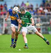 1 June 2014; Patrick Maher, Tipperary, is shouldered off the ball by Wayne McNamara of Limerick. Munster GAA Hurling Senior Championship, Semi-Final, Tipperary v Limerick, Semple Stadium, Thurles, Co. Tipperary. Picture credit: Ray McManus / SPORTSFILE