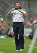 1 June 2014; Limerick manager TJ Ryan celebrates during the game. Munster GAA Hurling Senior Championship, Semi-Final, Tipperary v Limerick, Semple Stadium, Thurles, Co. Tipperary. Picture credit: Diarmuid Greene / SPORTSFILE