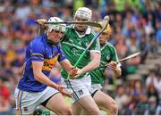 1 June 2014; Patrick Maher, Tipperary, in action against Tom Condon, Limerick. Munster GAA Hurling Senior Championship, Semi-Final, Tipperary v Limerick, Semple Stadium, Thurles, Co. Tipperary. Picture credit: Ashleigh Fox / SPORTSFILE