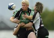 12 May 2006; Mark McHugh, Connacht, is tackled by Shane Williams, Ospreys. Celtic League, Connacht v Ospreys, Sportsground, Galway. Picture credit: Damien Eagers / SPORTSFILE