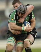 12 May 2006; John Muldoon, Connacht, is tackled by Ian Evans, Ospreys. Celtic League, Connacht v Ospreys, Sportsground, Galway. Picture credit: Damien Eagers / SPORTSFILE