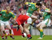 14 May 2006; Colin Goss, Louth, is tackled by Peadar Byrne, centre, Graham Geraghty, left and Joe Sheridan, Meath. Bank of Ireland Leinster Senior Football Championship, Round 1, Meath v Louth, Croke Park, Dublin. Picture credit; David Maher / SPORTSFILE