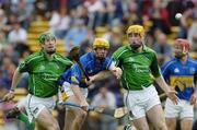 14 May 2006; Shane McGrath, Tipperary, is tackled by Paul O'Grady, right, and Seamus Hickey, Limerick. Guinness Munster Senior Hurling Championship Quarter Final, Tipperary v Limerick, Semple Stadium, Thurles, Co. Tipperary. Picture credit; Ray McManus / SPORTSFILE