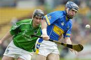 14 May 2006; Eoin Lelly, Tipperary, is tackled by TJ Ryan, Limerick. Guinness Munster Senior Hurling Championship Quarter Final, Tipperary v Limerick, Semple Stadium, Thurles, Co. Tipperary. Picture credit; Ray McManus / SPORTSFILE