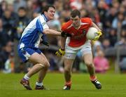 14 May 2006; Ronan Clarke, Armagh, is tackled by James Coyle, Monaghan. Bank of Ireland Ulster Senior Football Championship, Round 1, Armagh v Monaghan, St. Tighernach's Park, Clones, Co. Monaghan. Picture credit; Damien Eagers / SPORTSFILE